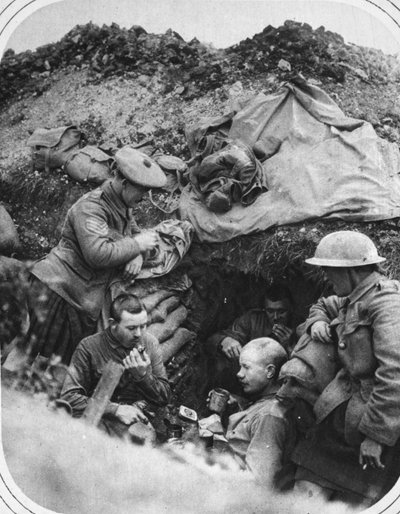 Dinner time in the trenches: A happy party at a dug-out during the British advance, illustration from 